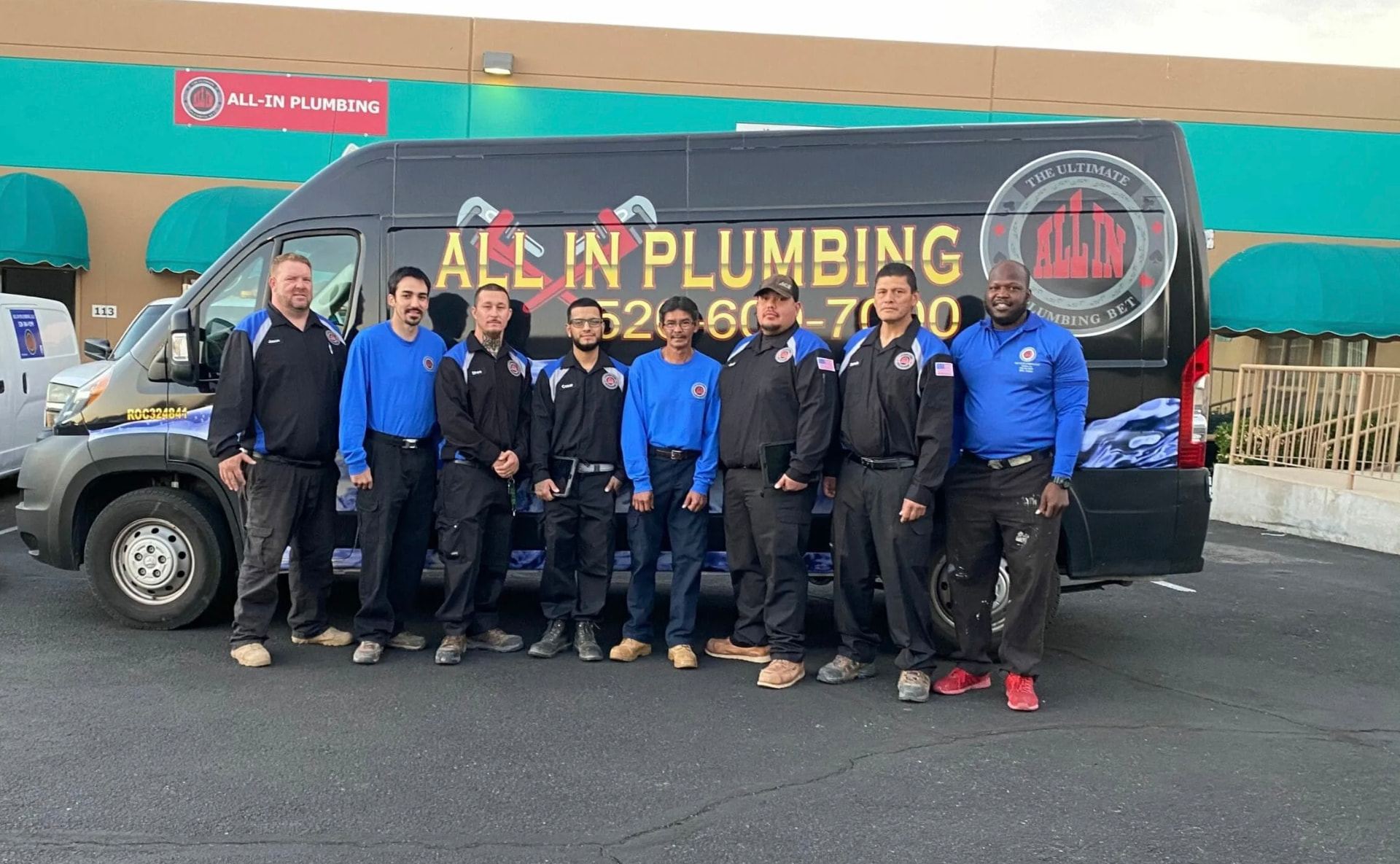 All In Plumbing team standing in front of a service van in Tucson, Arizona.